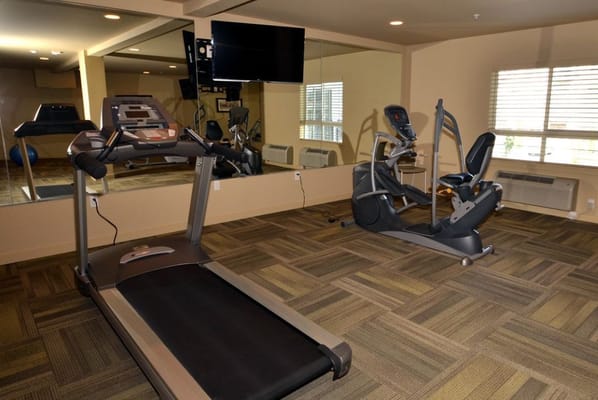 Fitness equipment in a well-lit gym area