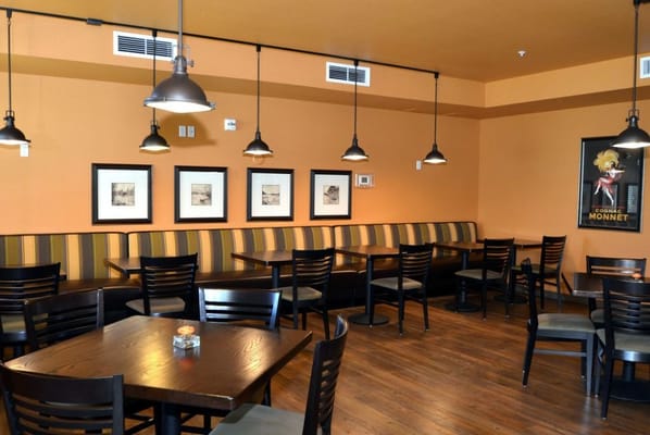 Cozy dining area with seating and framed art