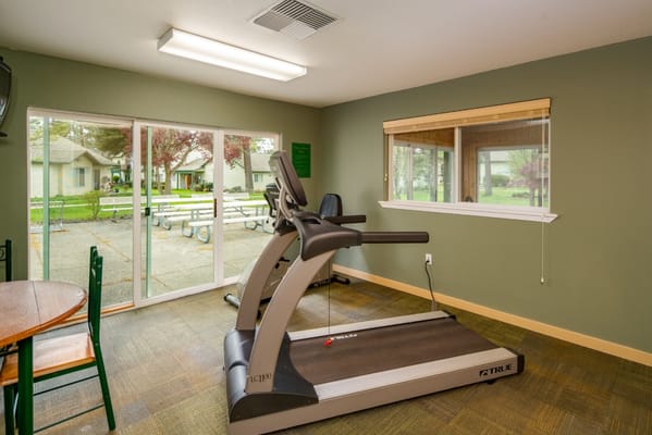 Interior view of a fitness area with treadmill