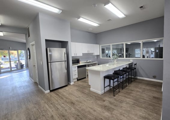 Bright, modern kitchen area with stainless steel appliances