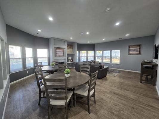 Bright common area with seating and dining table