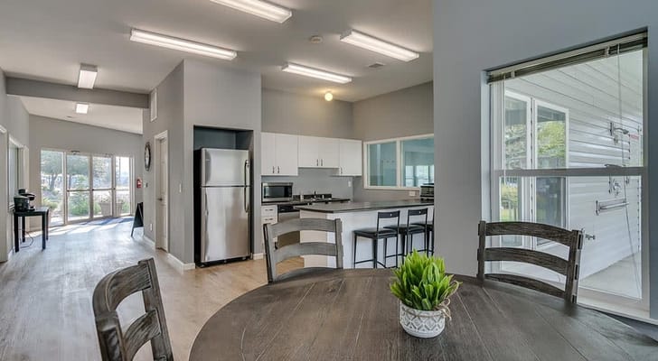Interior view of a modern dining area with kitchen