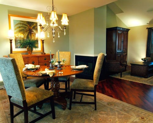 A dining area with a table set for a meal