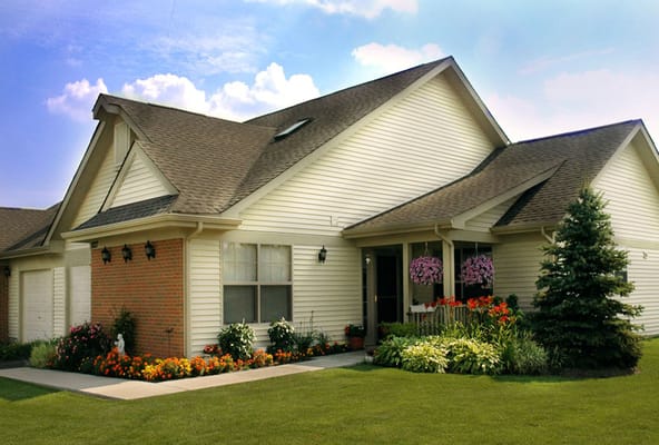 Exterior view of a senior living facility with flowers