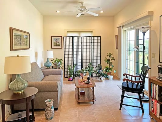 Cozy common area with comfortable furniture and plants
