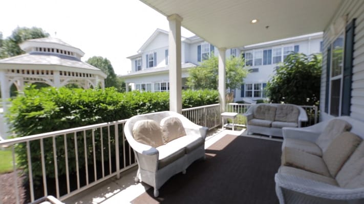 Outdoor seating area with a gazebo and landscaped garden