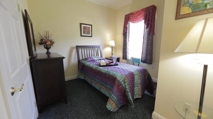 Cozy bedroom with colorful bedding and soft lighting