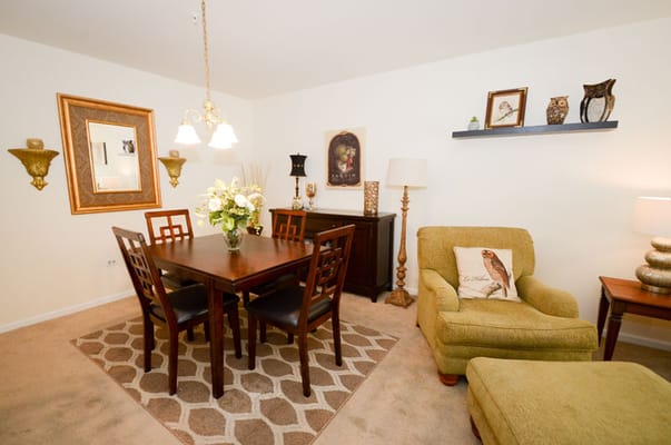 A cozy dining area with a table and chairs