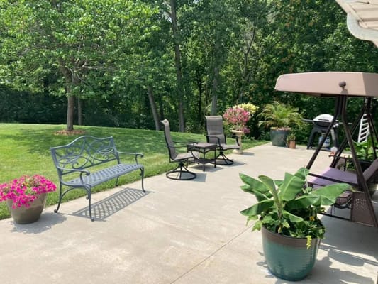 Outdoor patio with seating and potted plants