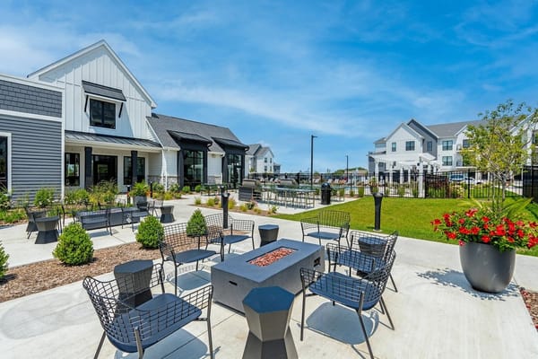 Outdoor seating area with fire pit and landscaping