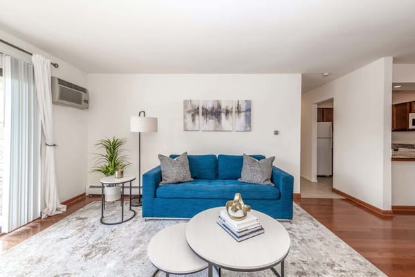 Bright interior living space with a blue couch