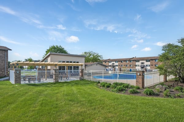 Outdoor pool area with seating and lounge space