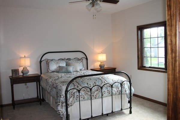 Cozy bedroom with a bed and window light