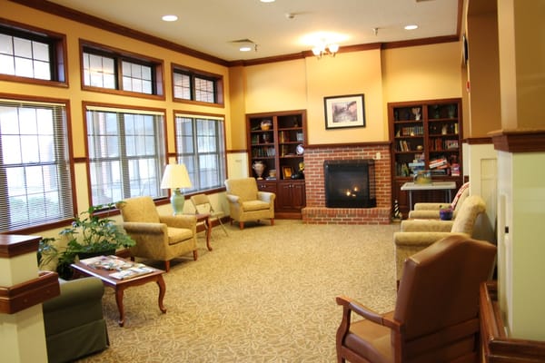Cozy common area with seating and a fireplace