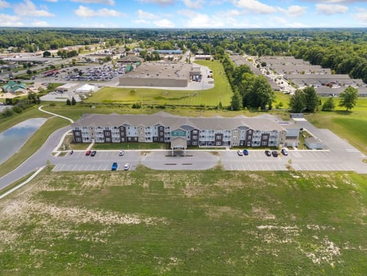 Aerial view of 41 North Senior Living facility with parking and green space