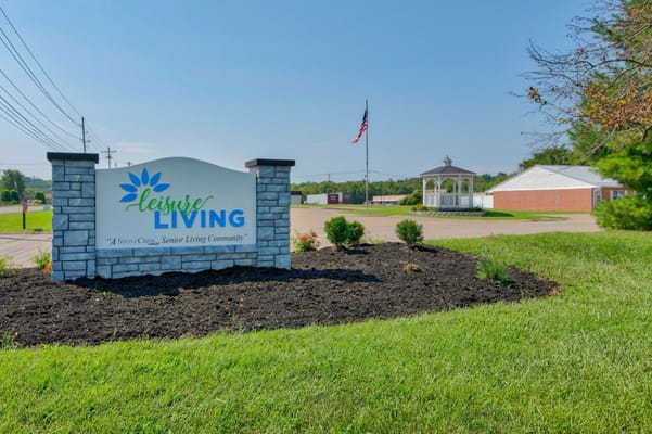 Sign for Leisure Living senior community at the entrance.