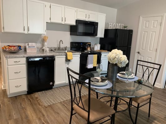 Modern kitchen with a dining table set for two