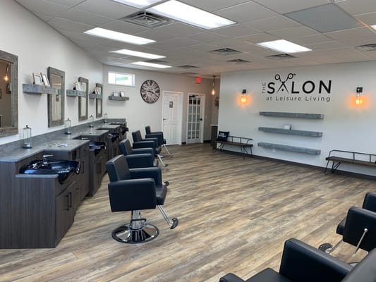Interior view of the salon with chairs and mirrors