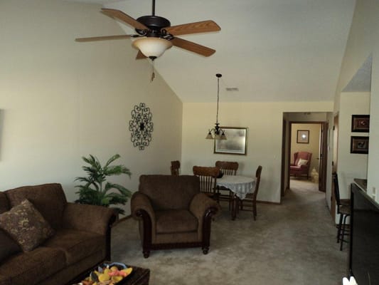 Cozy living room with a ceiling fan and furniture
