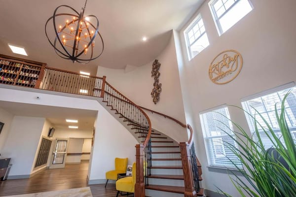 Bright and welcoming lobby with a staircase