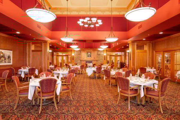 Elegant dining room with round tables and red decor