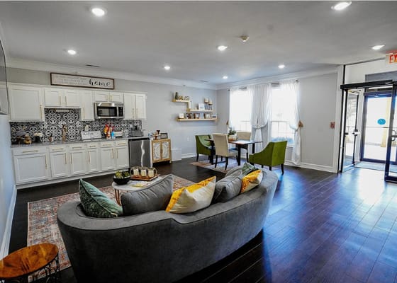 Cozy living room with a kitchen area and dining table