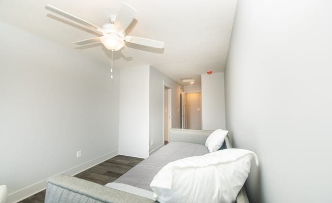 Bright, minimalist private room in assisted living facility