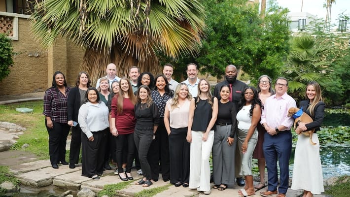 Group of staff members posing outdoors