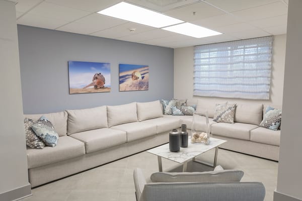 Comfortable common area with seating and artwork