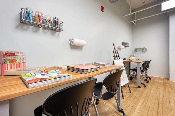 Art supplies and tables in a creative activity room