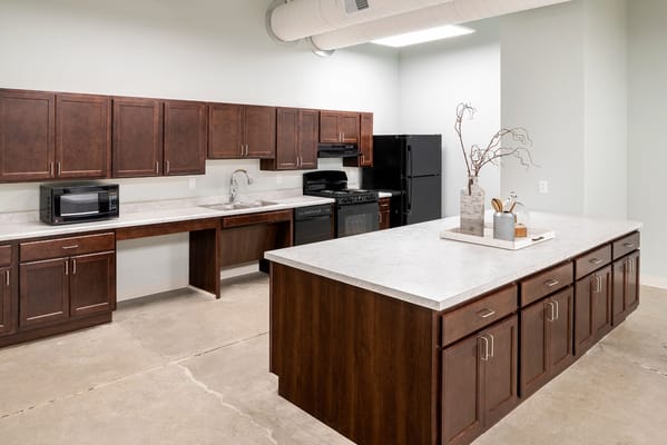 Modern kitchen space with cabinets and appliances