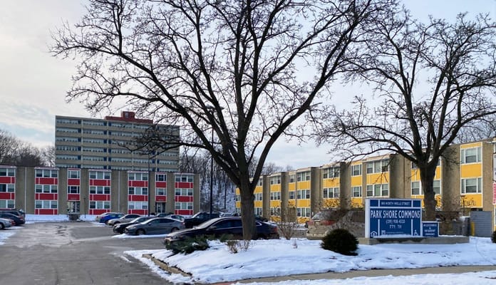 Exterior view of Park Shore Commons building and parking lot