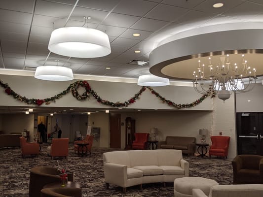 Interior view of a festive common area with decorations