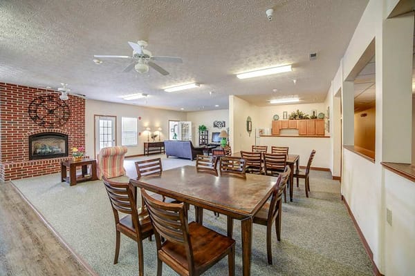 Common area with a dining table and seating
