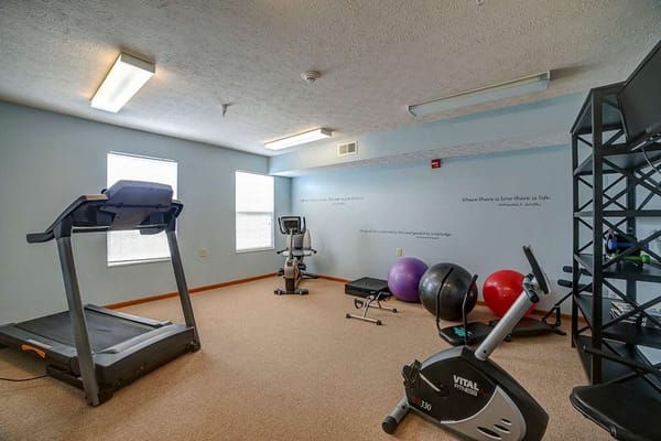 Well-equipped fitness room with exercise equipment