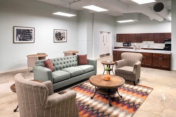 Cozy common area with seating and kitchen appliances