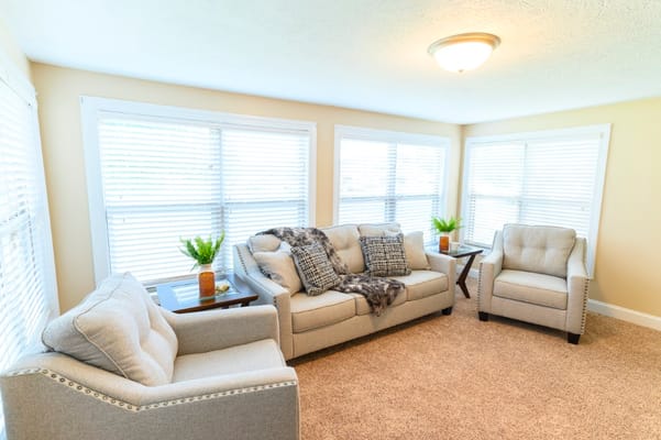 Well-lit interior lounge area with comfortable seating