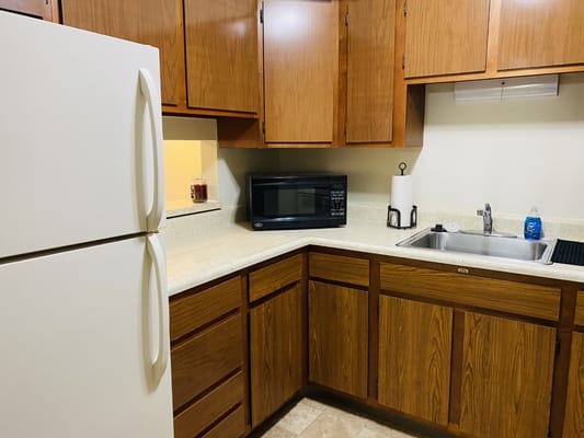 Corner view of a kitchen with appliances