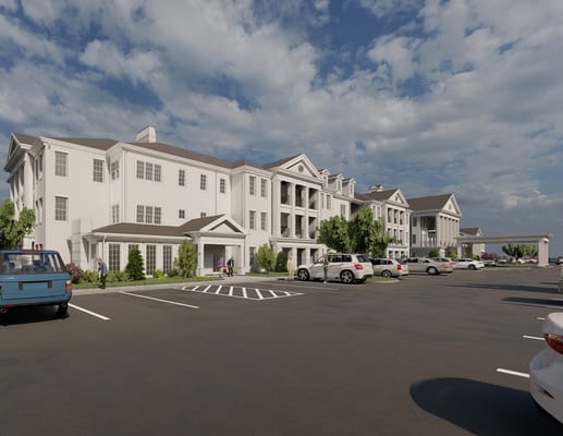 Exterior view of a senior living facility with parking