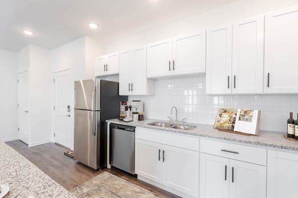 Modern kitchen area with appliances and decor