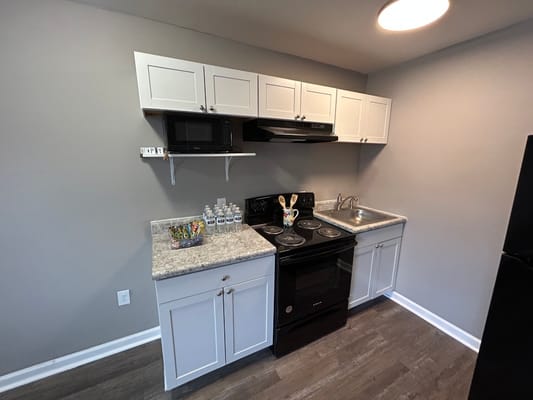 A kitchenette area with modern appliances