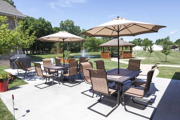 Outdoor patio area with seating and umbrellas