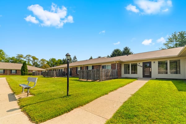 Building exterior of Fairington of Anderson with green lawn