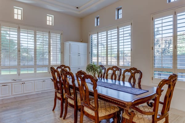 Elegant dining room with a large wooden table and chairs