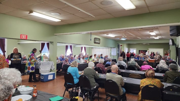 Residents enjoying a large gathering in the activity center