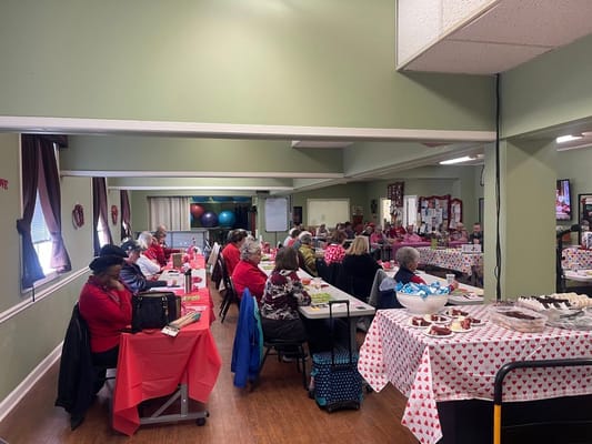 Residents participating in a lively activity in the common area