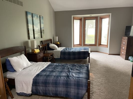 A cozy private resident room with two beds