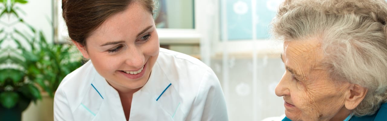 Caregiver interacting with a senior resident