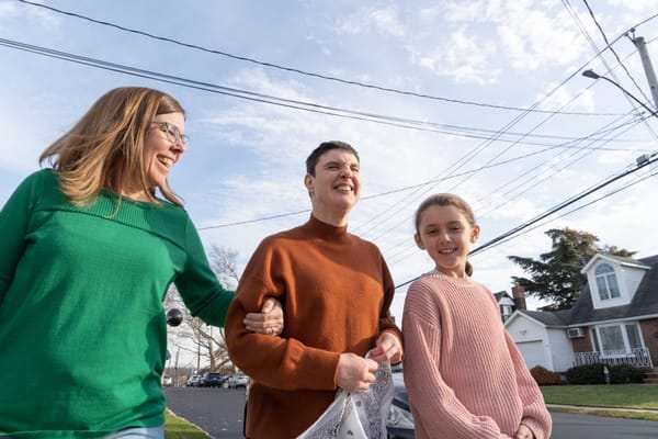 Three people enjoying a walk outdoors together