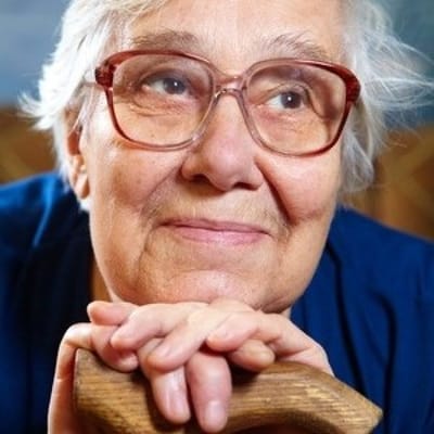 Senior woman smiling with a cane
